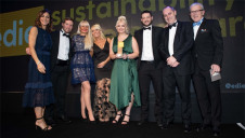 Compere Julia Bradbury (left) and Harvey Laud of Reconomy (right) presenting the Marston's team with the award